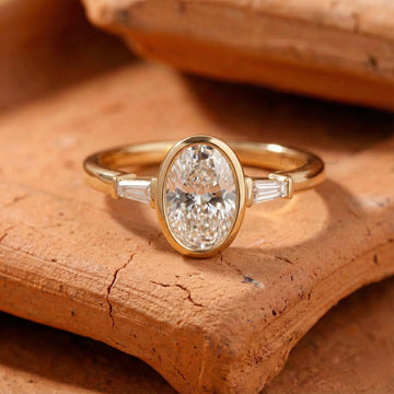 Bezel Set Oval Cut Lab Grown Diamond Three Stone Ring