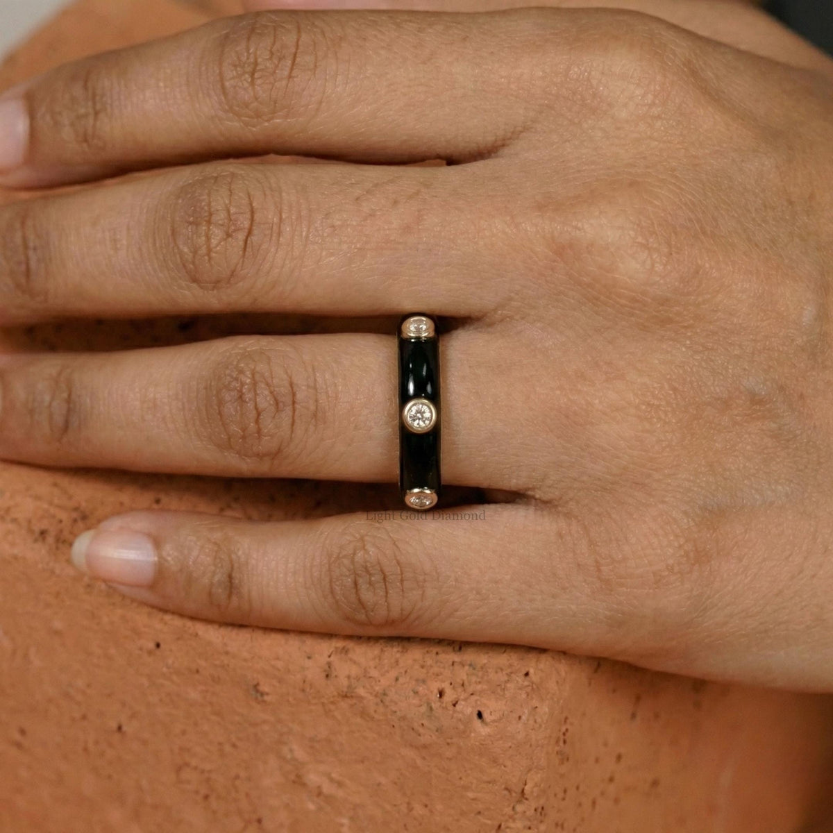 Trendy Diamond Spacing Black Band Finger pose 
